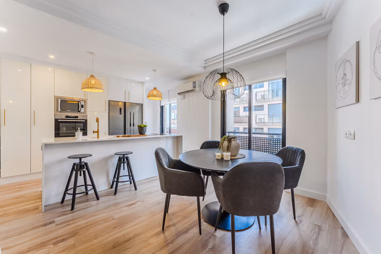 Open kitchen and dining area at Adeje Coastal Nest, with the balcony door open
